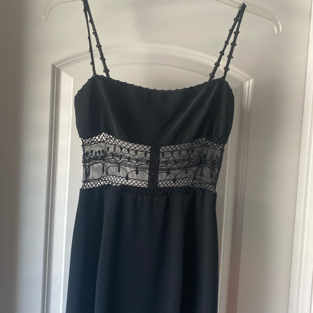 Black evening gown. Mesh design above waste. Size 4. From Cache